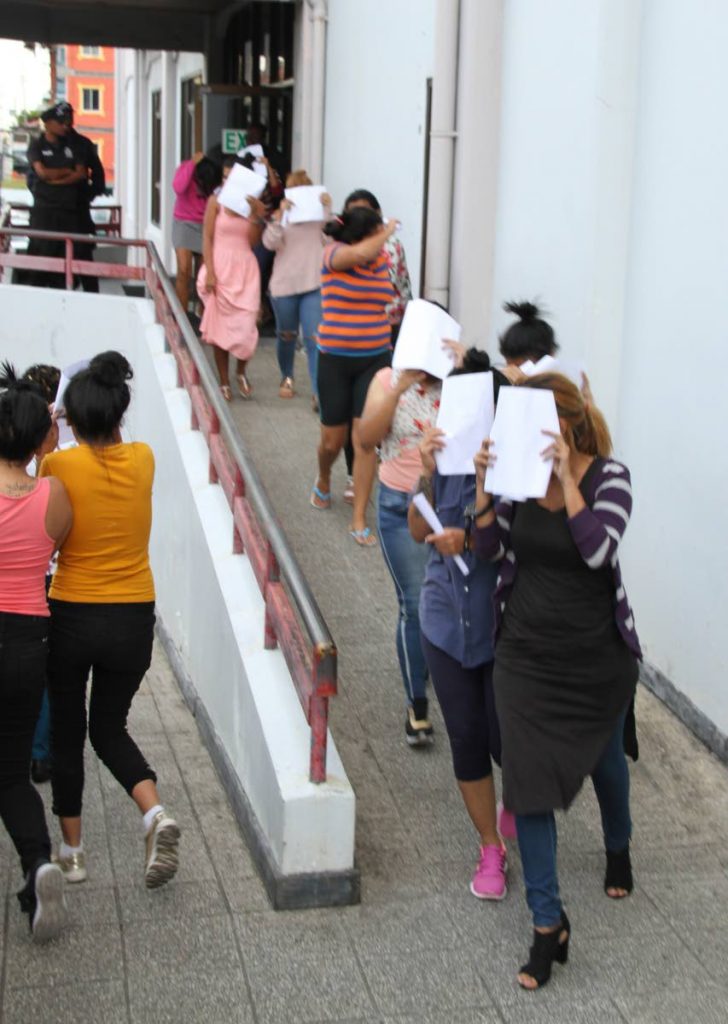 Venezuelan women leave the San Fernando High Court on Friday after being fined for illegal entry. PHOTO BY VASHTI SINGH