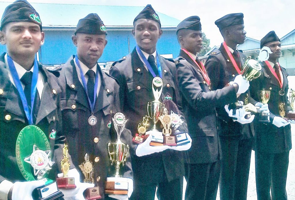 Special prize winners, from left, Tearath Narine, Emmanuel Mitchell, Oba Stewart, Musa Ramlagan, Javon Coppin and Romario Boodram at the passing out parade, NESC, Couva on Saturday.