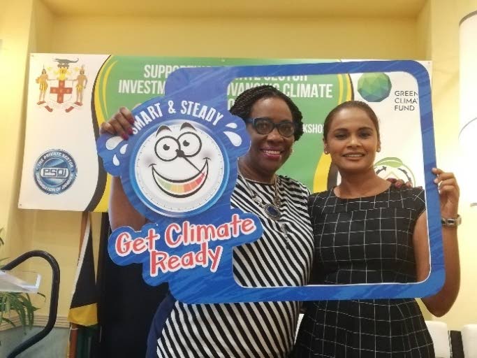 Una-May Gordon, director of the Climate Change Division and the NDA for Jamaica, left, and Sasha Jattansingh, senior technical officer at Canari pose with Barry, Jamaica’s new climate change mascot.  PHOTO BY CANARI