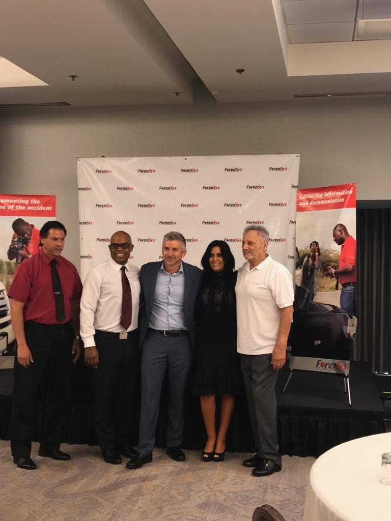 From left to right: Nicholas Garcia, Claims Manager, Beacon; Rae Smith, ForenSys T&T Operator CEO;  Mr. Christopher Woodhams, Chief Operating Officer, Beacon; Caroline Hollander CEO ForenSys Caribbean and Gerald Hadeed, Chief Executive, Beacon share a picture at the Hyatt regency on Wednesday during the official signing of an agreement between ForenSys and several insurance companies. 