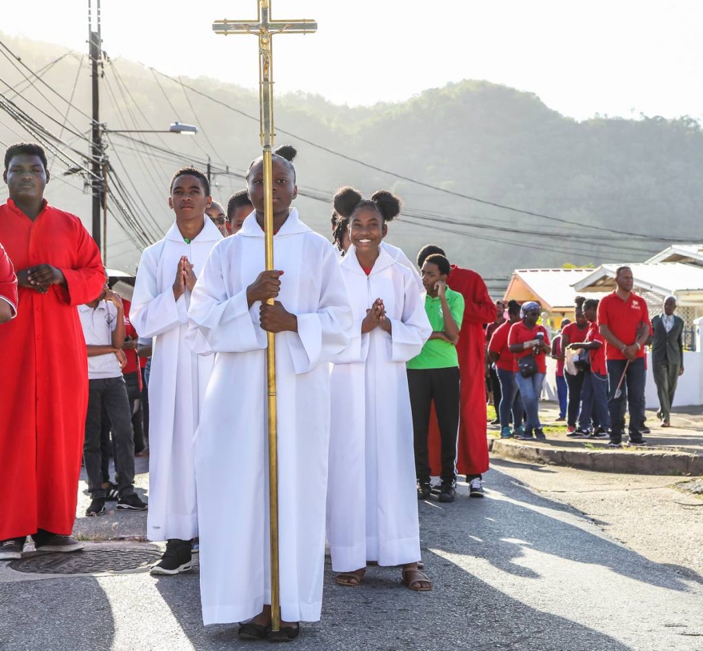 Members of the St Michael's Anglican Church and the St John's R.C. Church performed the stations through Diamond Vale Diego Martin to  Calvary Hill, Covgine Road, Diego Martin. PHOTO BY JEFF K. MAYERS 