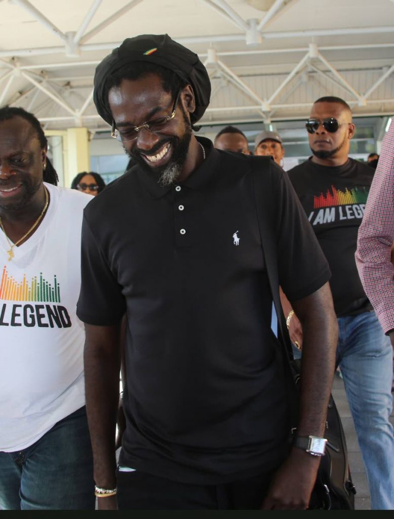  Jamaican reggae artiste Buju Banton arrives at the old Piarco airport yesterday. 

Photos: Sureash Cholai