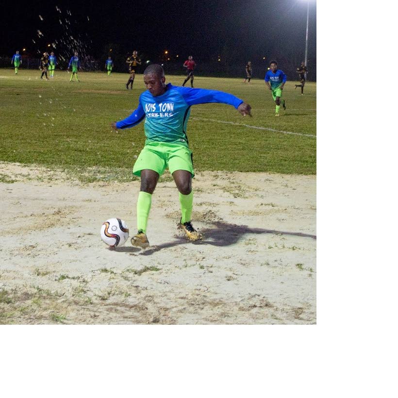 A Boys Town player collects the ball in a previous match of the Sweet Sixteen Football League at the Ojoe Road Recreation Ground, Sangre Grande. PHOTO COURTESY SWEET SIXTEEN FOOTBALL LEAGUE.