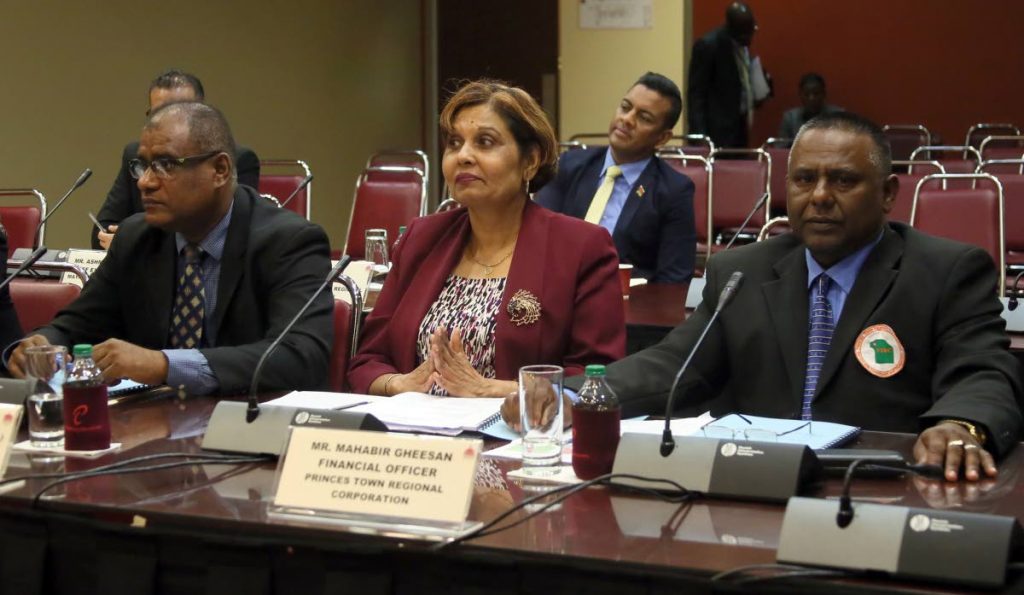 CORPORTATION TALKS: From left, Princes Town Regional Corporation chairman Gowrie Roopnatine, CEO Sheriffa Heru and financial officer Mahabir Gheesan speak at a JSC yesterday in Port of Spain. 
