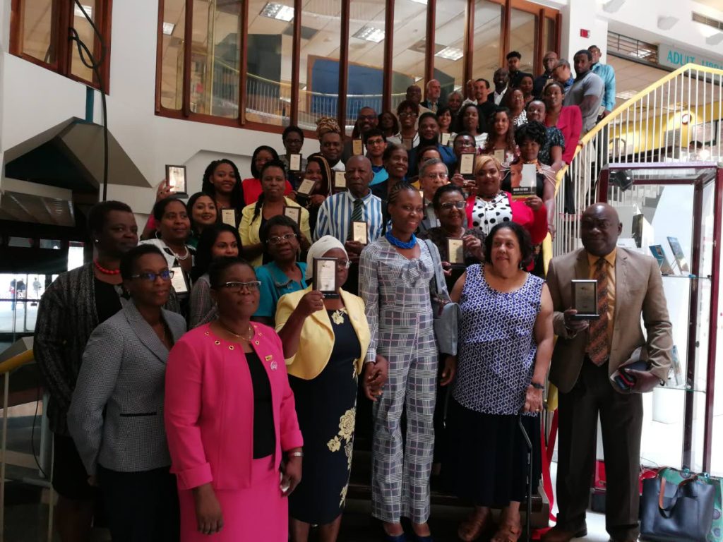 The first time authors with members of Nalis and Nataki Atiba-Dilchan, permanent secretary of the Ministry of Communications, front row centre.


Photos: Joan Rampersad
