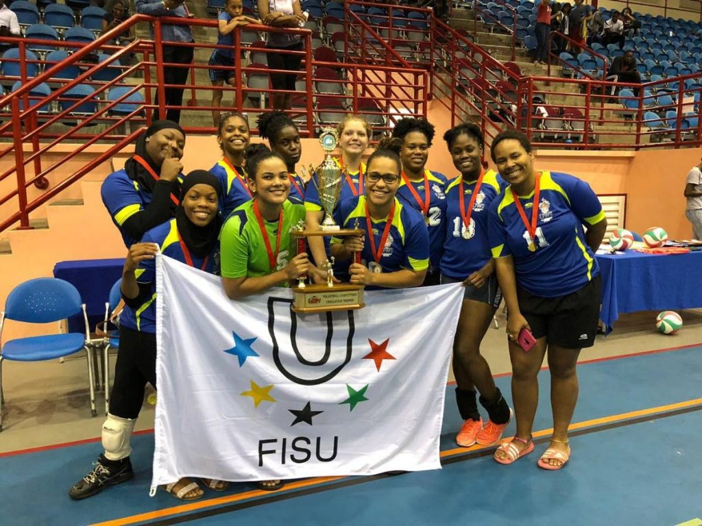 Members of the UWI Volleyball team after winning the women’s title on Wednesday night. PHOTO COURTESY SHERDON PIERRE