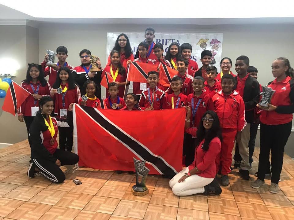 TT’s chess team display their medals and trophies after competing at the Carifta Chess Championships, in Curacoa, on the Easter weekend.