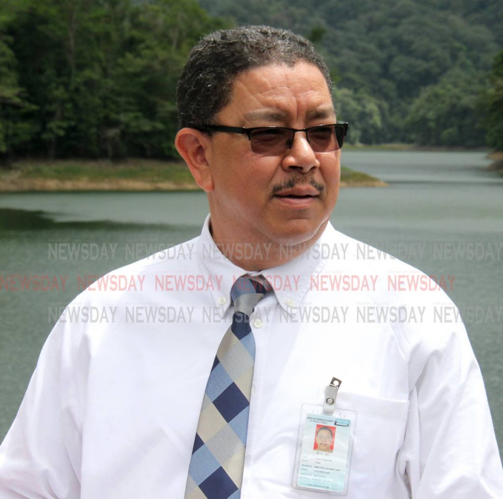 Director, Customer Care (Ag.), Alan Poon-King, speaks to the media at Hollis Dam, Valencia. Photo by Angelo Marcelle