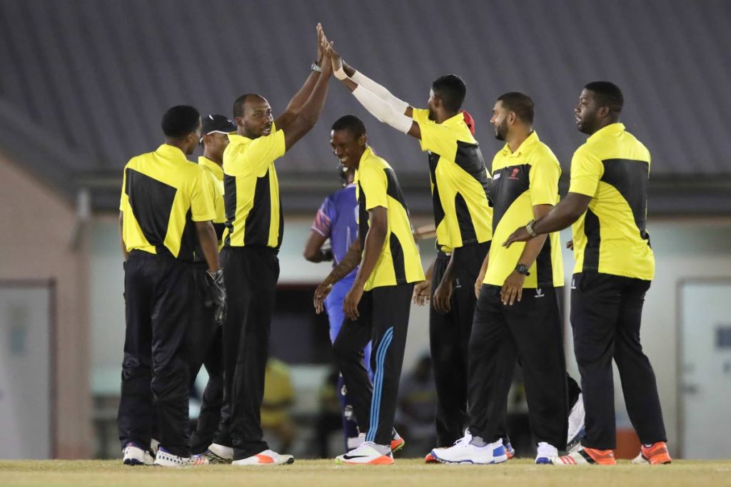 In this Jan 14, 2018 file photo, Merry Boys players congratulate each other after the dismissal of UWI’s Jasbour Findlay, during a UWI-Unicom T20 tournament match, at the Sir Frank Worrell Ground, St Augustine. Merry Boys, on Sunday, were relegated from the National League Premier I division.