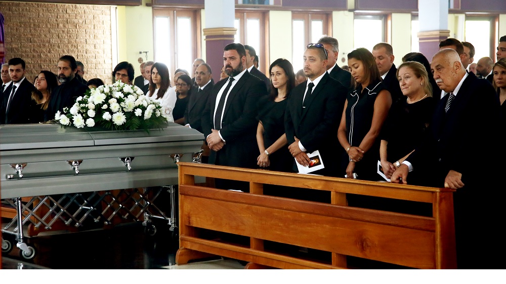 Family and friends of the late Richard Fakoory, chairman of the TT Pro League, stand during his funeral yesterday, at the St Finbar's RC Church, Diego Martin. Fakoory died last Wednesday. He was 71.