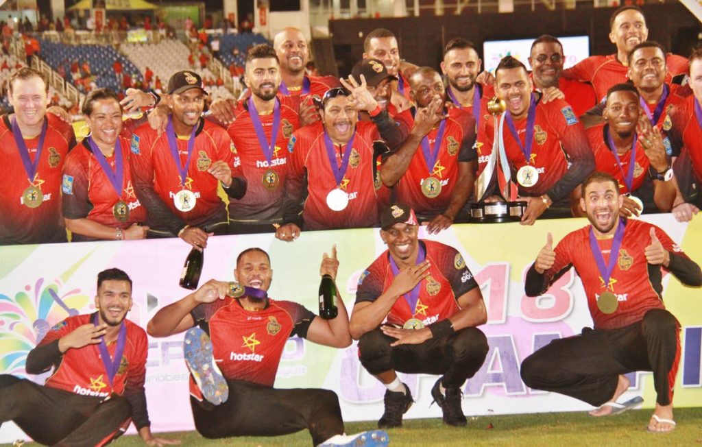 The Trinbago Knight Riders pose with their medals after beating the Guyana Amazon Warriors, in the 2018 Hero CPL final at the Brian Lara Academy, Tarouba.