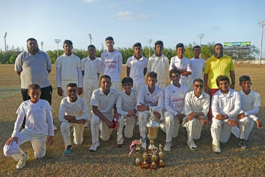 Central Zone players and technical staff with their trophies after winning the TT Cricket Board Inter Zone Under-15 tournament earlier this year. PHOTO COURTESY TTCB
