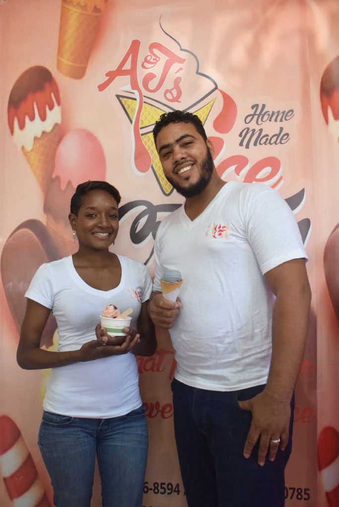 Anthony Henry and his wife June-Ann, owners of A&J Homemade Ice Cream, offer two of their signature flavours, Strawberry Medley and Dark Vanilla, at their Chaguanas store.