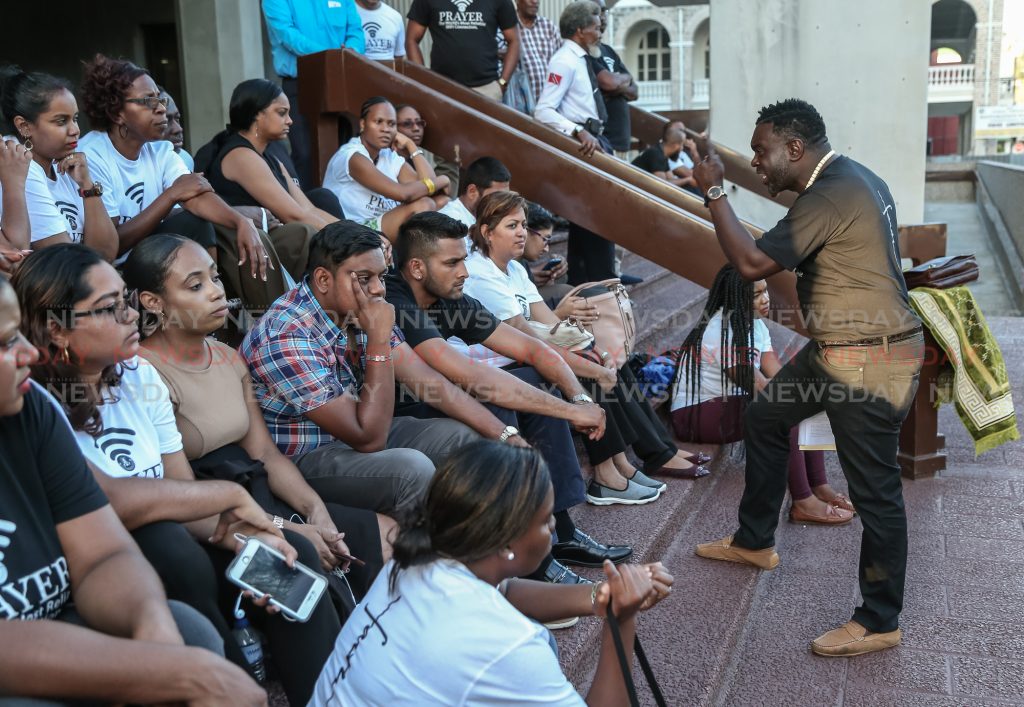 PSA president Watson Duke addresses judiciary staff outside the Hall of Justice, Port of Spain ahead of an all-night vigil.

Photos: Jeff K Mayers