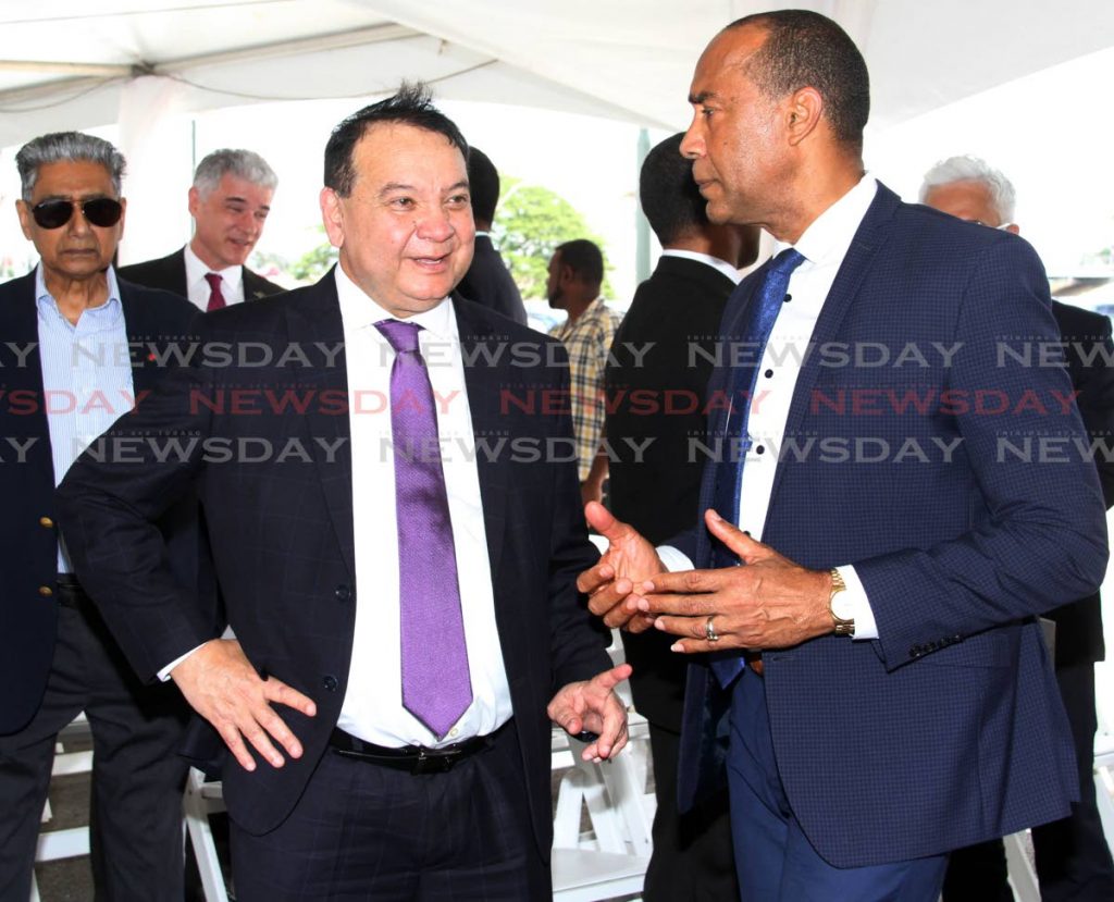 Minister of Energy and Energy Industries Franklin Khan chats with NGC Group chairman Gerrry Brooks.