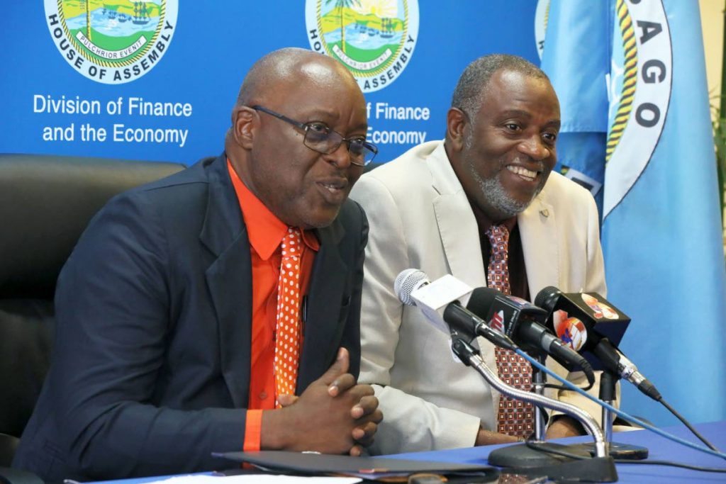 Chief Secretary Kelvin Charles and George Leacock, chairman of the Tobago Festivals Commission speaking to the media at last week’s post Executive Council media briefing. 