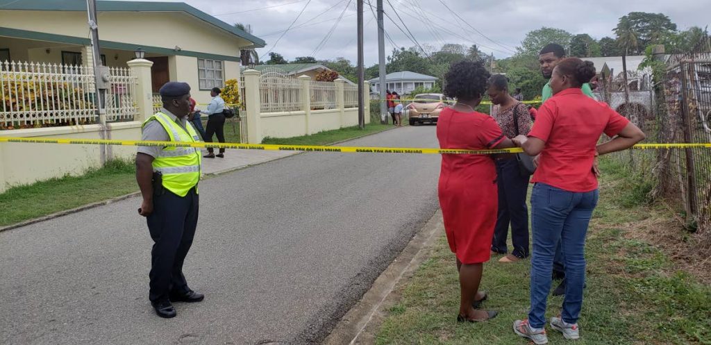 Police block of Cocrico Ave in Bucco, around the home of John “Joker” Mills, 70, and his common-law wife Eulyn John after the couple was discovered brutally murdered at the house yesterday.