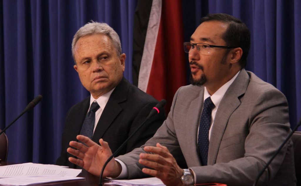 Minister of National Security Stuart Young, right, speak at the post Cabinet news conference held at the Diplomatic Centre, St Ann's, on Thursday. Looking on is Minister of Finance, Colm Imbert. PHOTO BY AYANNA KINSALE
