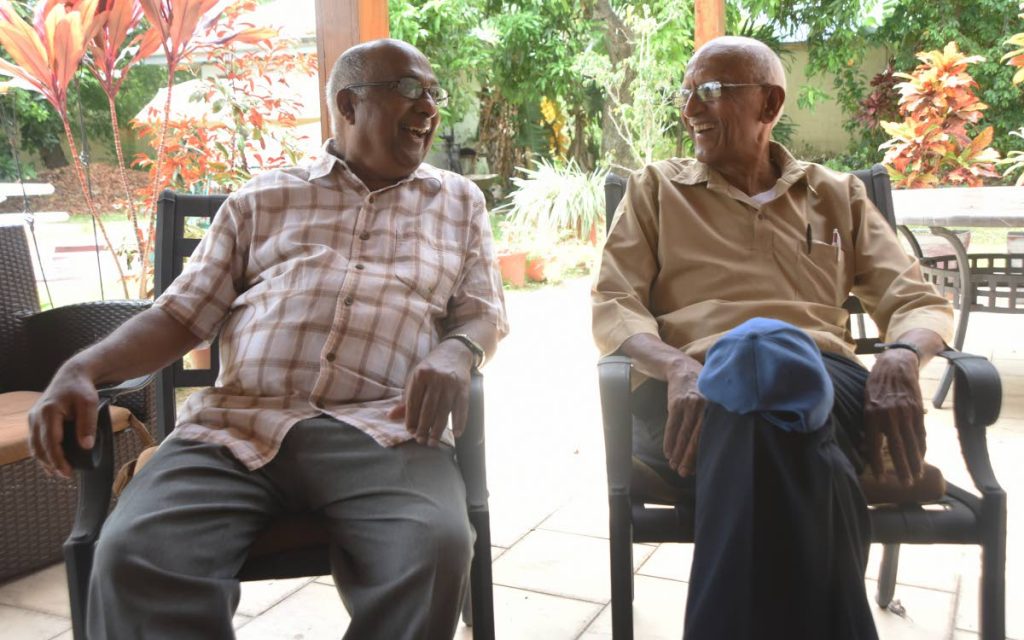 Heritage Communications chairman Hans Hanoomansingh, left, and geneaologist Shamshu Deen chat about the history of Indian indentured immigrants at Hanoomansingh's home in Valsayn. PHOTOS BY KERWIN PIERRE