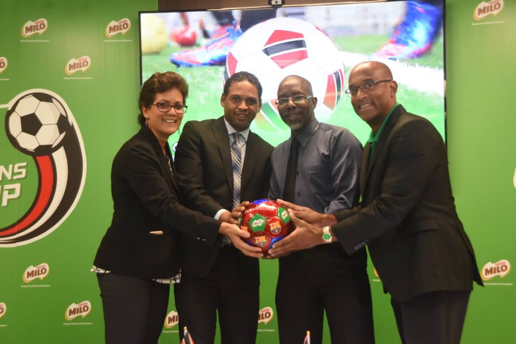 Head of Corporate Communications Nestle Denise d’Abadie, left, assessment coach Milo Champion cup Damian Cooper, acting dicector of Ministry of Sports and Youth Affairs Patrice Charles,and business executive officer Nestle Anglo-Dutch Caribbean region Sean Wallace during the launch of Milo Championships Cup at Nestle, Valsayn,yesterday. 