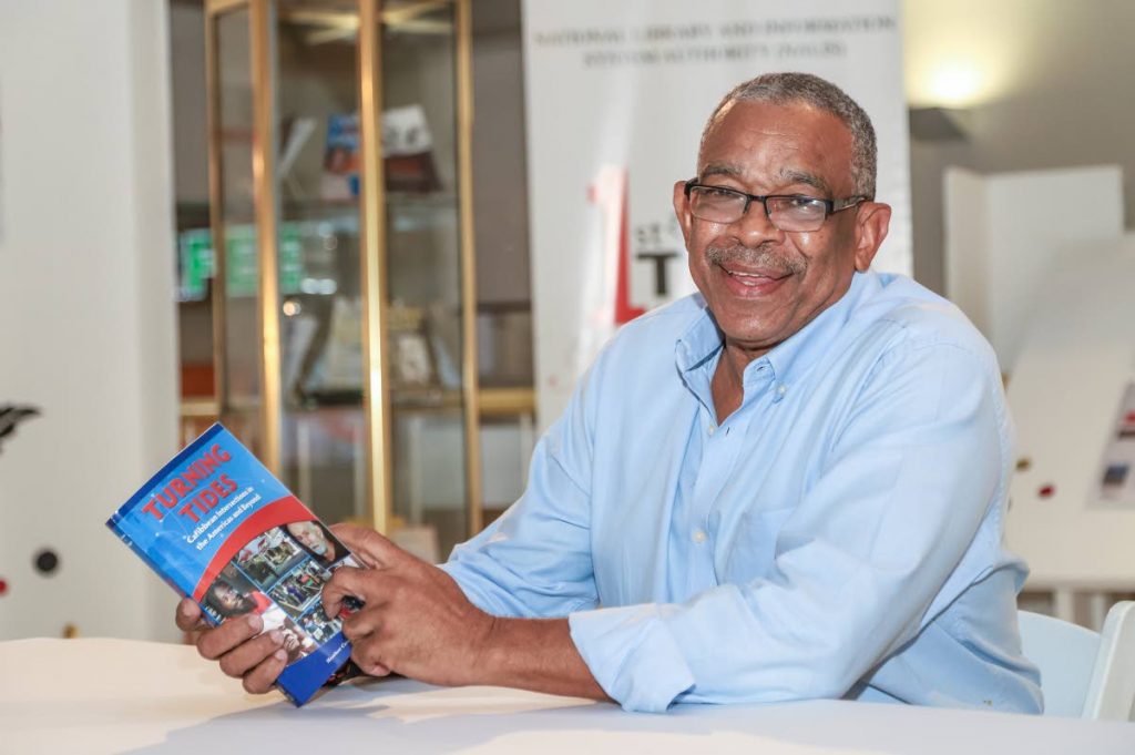 Ian Randle of Ian Randle Publishers Ltd with one recent release, Turning Tides: Caribbean Intersections in the Americas and Beyond at the National Library, Abercromby Street, Port of Spain.
