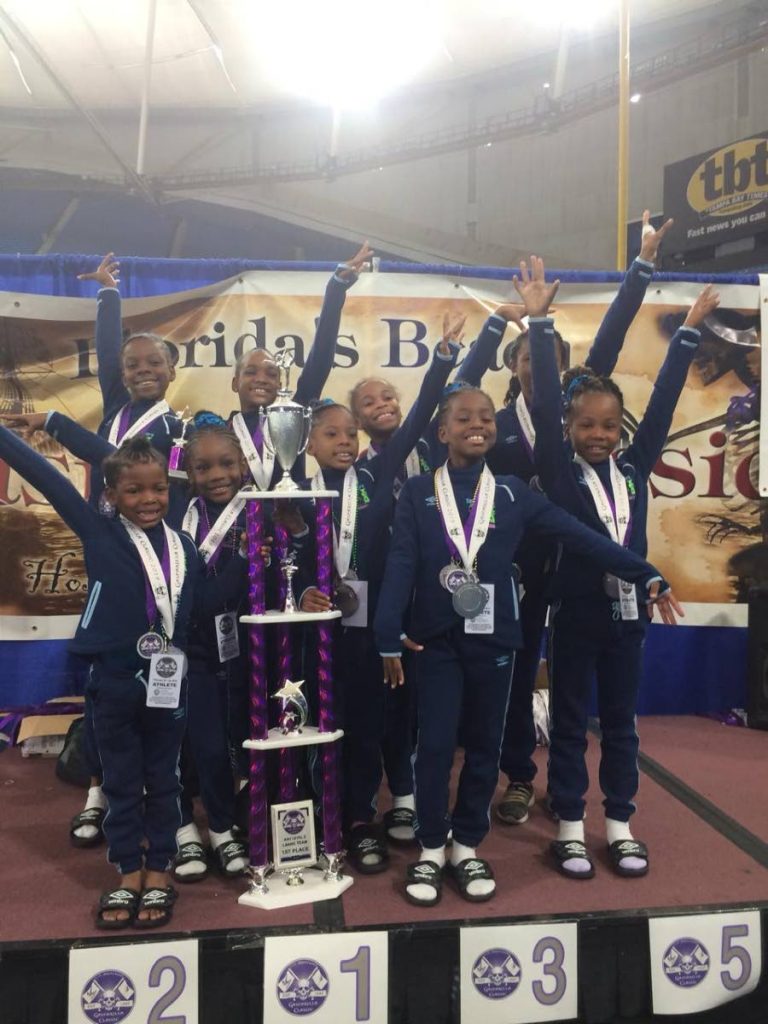 Teamwork Gymnastic Club members with their medals and trophy at the 31st annual Gasparilla Gymnastics Classic in St Petersburg, Florida recently.
