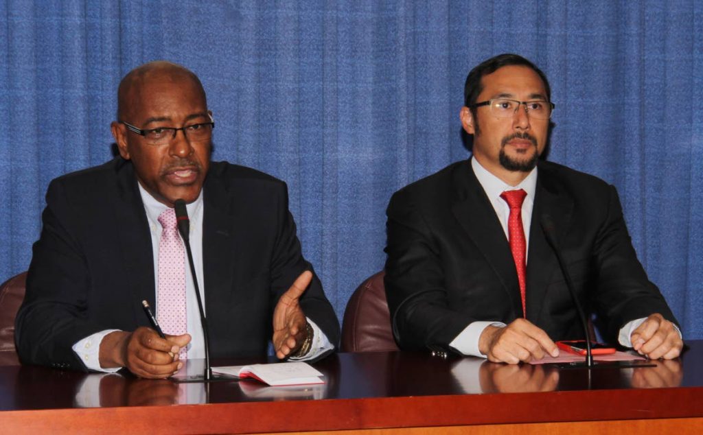 Communications Minister Stuart Young, right, and Minister of Public Utilities Robert Le Hunte, at Thursday's post-Cabinet media briefing at the Diplomatic Centre, St Ann's, Port of Spain. 