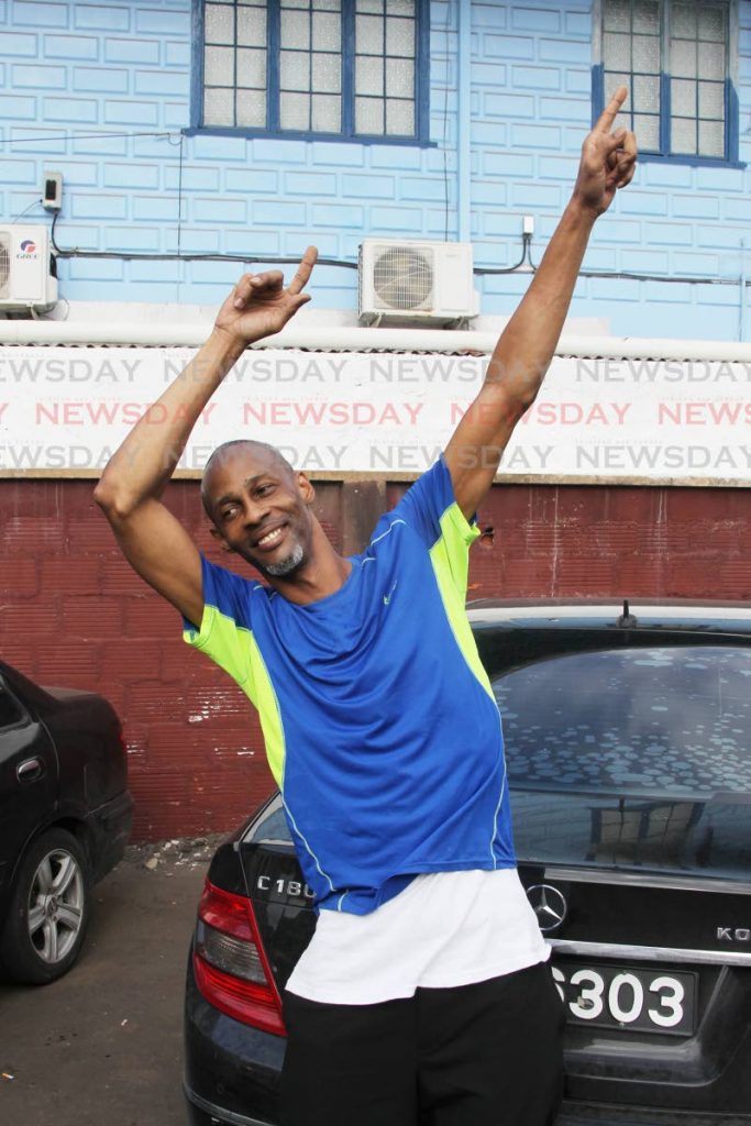 Marlon Lampkin celebrates his freedom outside the San Fernando High Court on Thursday yesterday, after being found not guilty of murdering his mentally ill uncle in 2011. Lampkin had spent eight years in prison awaiting completion of his trial. PHOTO BY LINCOLN HOLDER