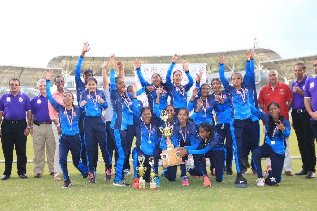 CHAMPIONS: Barrackpore East players and management celebrate after winning the Powergen Secondary Schools Cricket League (SSCL) Girls Intercol T20 title yesterday at the Brian Lara Academy, Tarouba. Also present are TT Cricket Board president Azil Bassarath (back row, second from right), SSCL president Surujdath Mahabir (right, back row) and representatives from title sponsor Powergen. PHOTO BY ALLAN V CRANE/CA-IMAGES