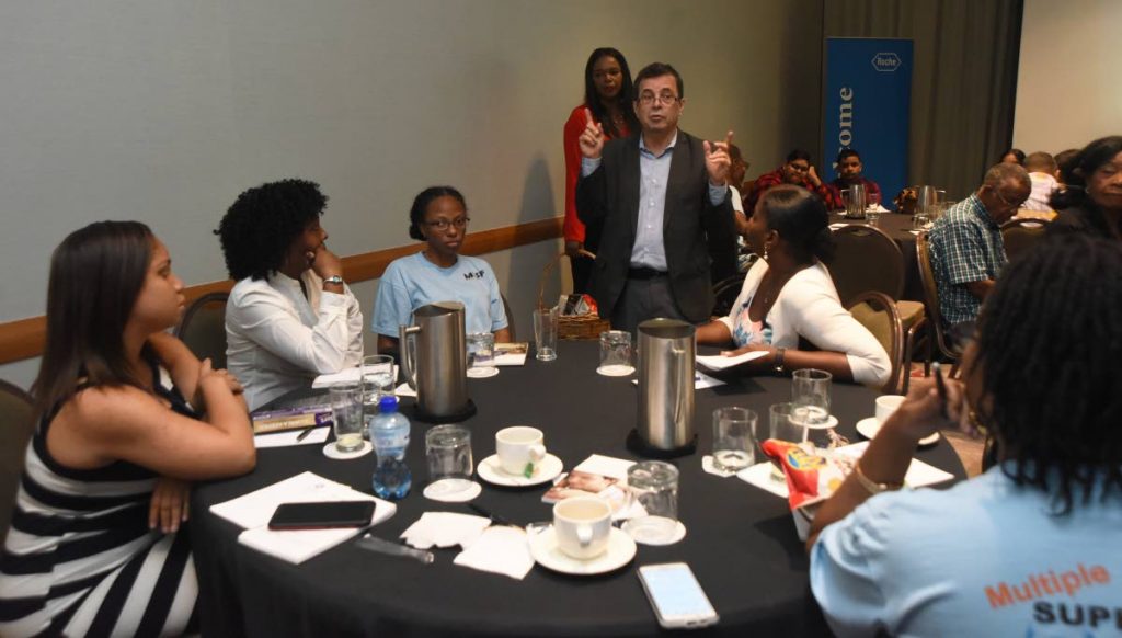 Multiple sclerosis patients, relatives and members of a support group listen to Dr Arnolodo Soto during a seminar at Hyatt Regency, Port of Spain on April 30.