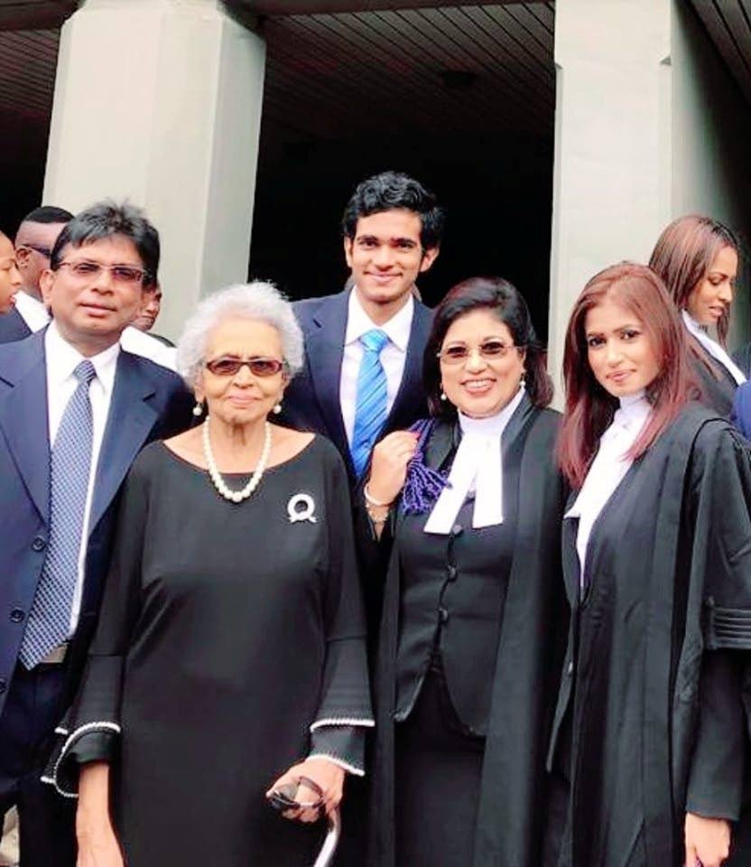 STANDING TOGETHER: COP Leader Carolyn Seepersad-Bachan (fourth from left) is supported (from left) by her husband Suresh, mother Irma Seepersad, son Suren and daughter Saskia after she was called to the bar on Friday at the Hall of Justice.