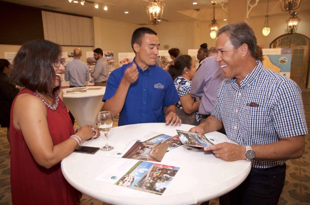 Sharing a light moment at the launch by Sagicor of the region’s first active adult wellness and lifestyle community, The Estates at St George, Barbados, on Thursday, May 2, at The Ballroom, Queen’s Park Oval, Port of Spain, are Joann Traboulay, left, of Terra Caribbean, Anthony Scott of AP Scott, and Jerome Marquez. Photo courtesy Sagicor