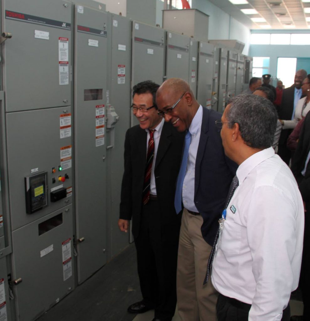 Public Utilities Minister Robert Le Hunte, centre, shares a joke with Ambassador of Japan Tatsuo Hirayama, left, and WASA head of projects Daren Gazee during a tour of the new Savenotta Booster Station at Pt Lisas on Friday. PHOTO BY VASHTI SINGH