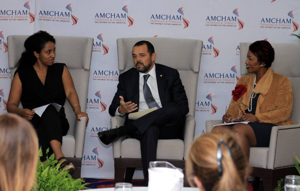 Nestle’s market head Anglo Dutch Caribbean, Patricio Torres, centre, speak during the American Chamber of Commerce seminar on business and gender diversity at the Radisson Hotel, Port of Spain on Friday. Also in the photo are head of gender, diversity and inclusion, IDB Invest, Stephanie Oueda Cruz, left, and JMMB chief marketing officer Lisa-Marie Alexander.  PHOTO BY AYANNA KINSALE