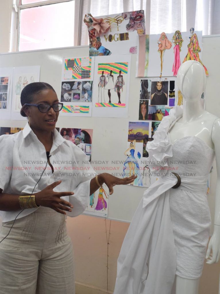 Kimon Baptiste-St Rose talks about her design at the UTT, John Donaldson Campus workshop for fashion desginers from the Caribbean on Friday. 