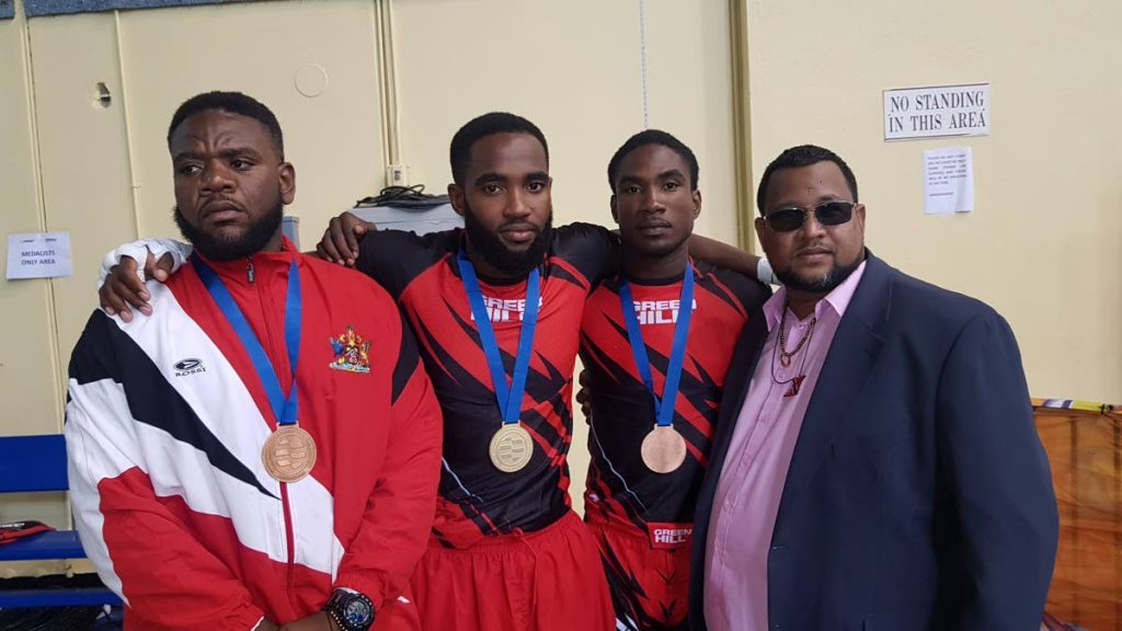 TT MMA Federation president Jason Fraser, right, with national fighters Erland Meloney, Lashawn Sladden and Jeremy Rudolfo at the 2019 Pan Am MMA Championships in Bahamas.  