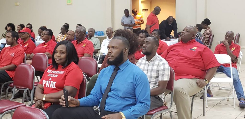 PNM supporters listen to speakers at a PNM Tobago Council meeting on Tuesday. 
