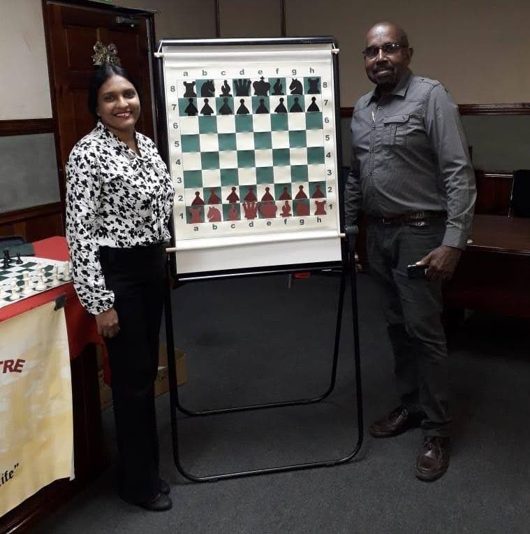 Dr Jo-Anne Sewlal (left) and Raymond Aaron, founders of the Point Fortin Chess Centre, with a demo board. 