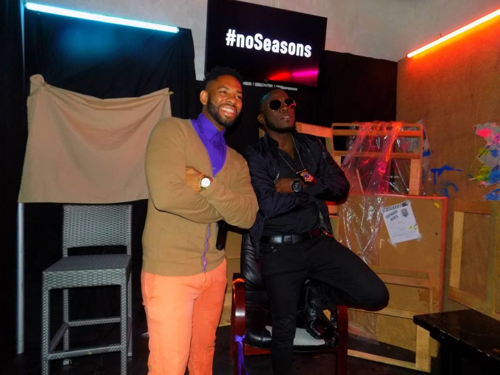 Soca artiste Erphaan Alves, right, poses with radio personality Hans Des Vignes at the premiere of Alves' music video 'Lock On' on Tuesday at Vas Lounge, Woodbrook. 