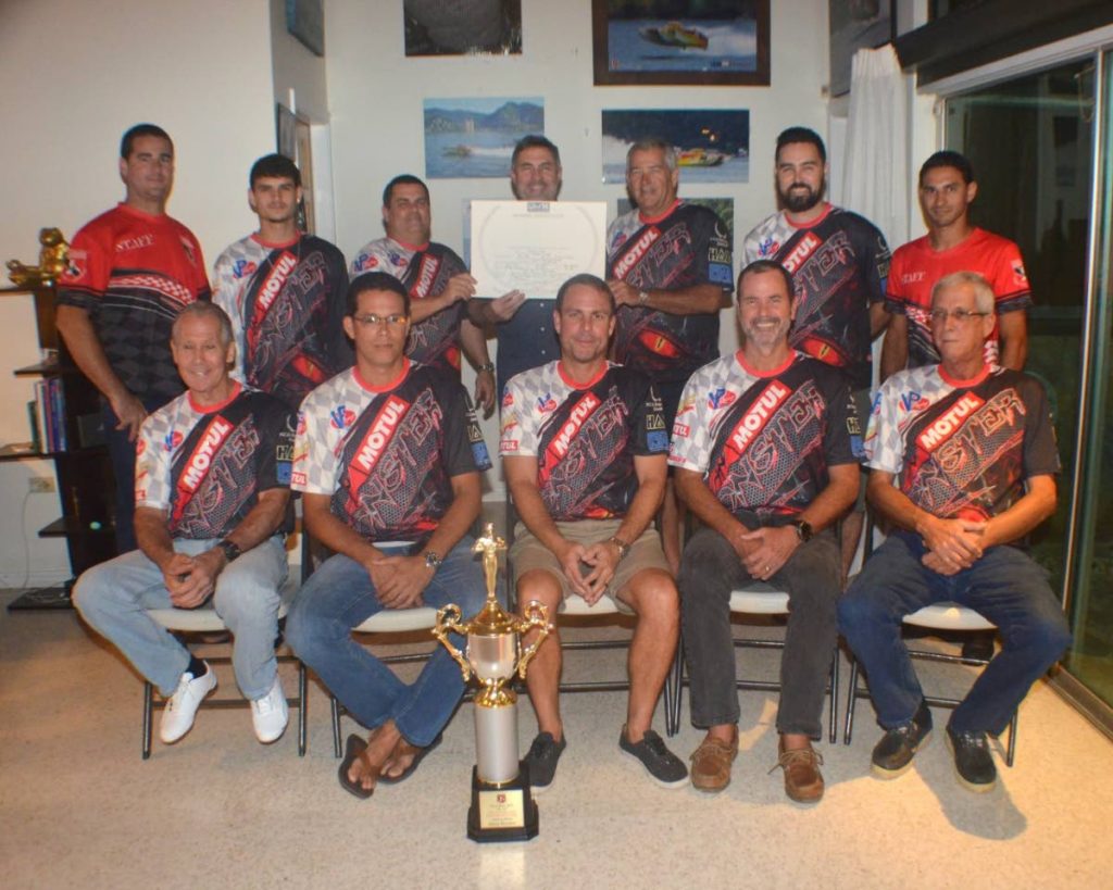 Members of Motul Monster with TT Powerboat Association (TTPBA) members at a function to recognise the world record achieved by Monster in the TT Great Race last year. President of the TTBPA Marcus Gomez, from back row left, Joshua Sabeeney, Joey Sabeeney, former TTBPA president Roger Bell, Peter Peake, Daniel Peake, Brent Branker of the TTPBA. Robin Geofroy, front row from left, Nicholas Gomes, Paul J Charles, Alfed Bell, Derrick Gomes.
