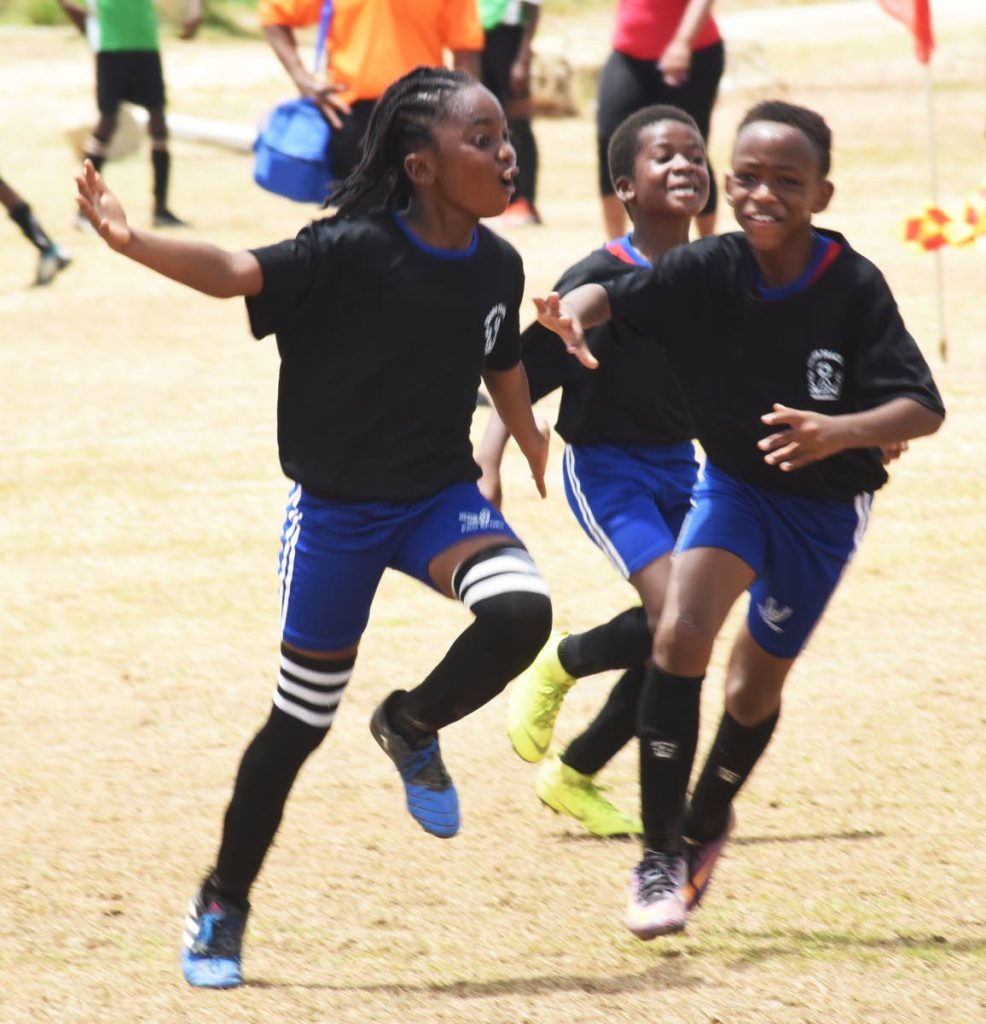 Merimba Melesse of Crown Trace United celebrates after scoring a goal during an 
Under-11 match. 
