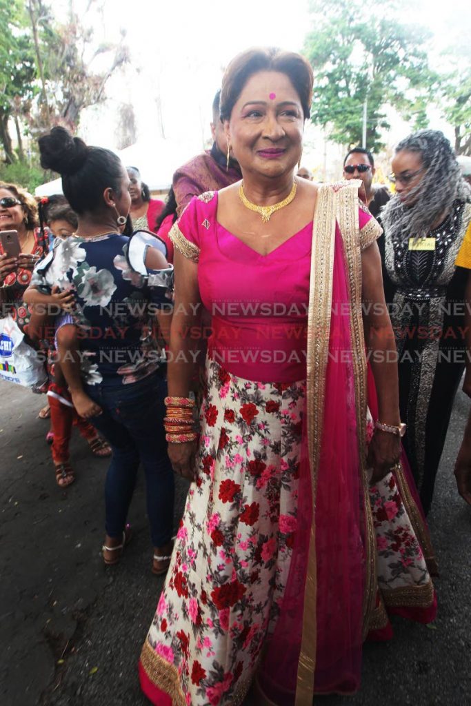 Opposition Leader Kamla Persad-Bissessar arrives at the Corinth/Cedar Hill Co-Ordinating  Committee 6th Annual Indian Arrival Day celebrations held at the Usine Ste Madeleine Pond on Sunday.  PHOTO BY LINCOLN HOLDER
