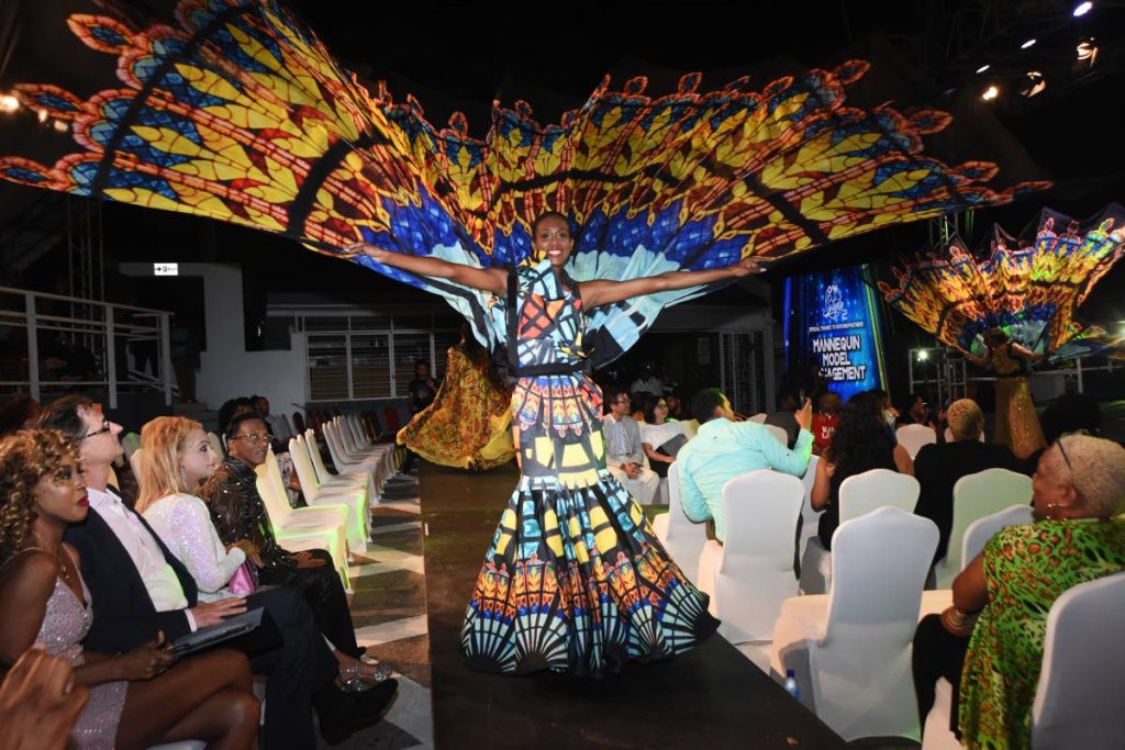 A model displays a costume from K2K Alliance and Partners' 2019 presentation Through Stained Glass Windows during O2N Style fashion show at O2Park, Chaguaramas, on Sunday. PHOTO BY KERWIN PIERRE
