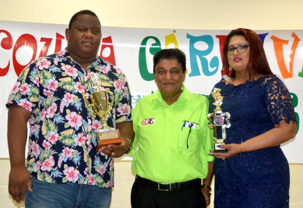 Couva Carnival Committee chairman Ramchand Rajbal Maraj, centre, with four-time J’Ouvert Band of the Year winners, Anton Legendre and Lolita Mohan .