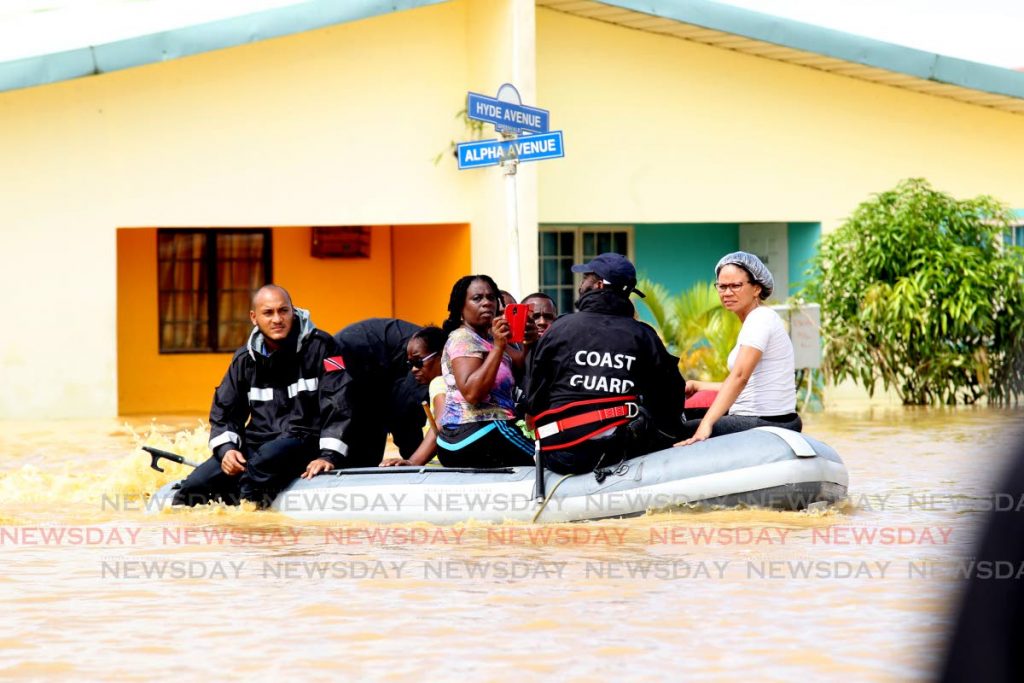 In this October 20, 2018 file photo Coast Guard members take Greenvale residents to safety  in a dinghy following devastating floods in the HDC development. HDC says it has done extensive repairs to units and mitigation works to minimise the risk of flooding. 


