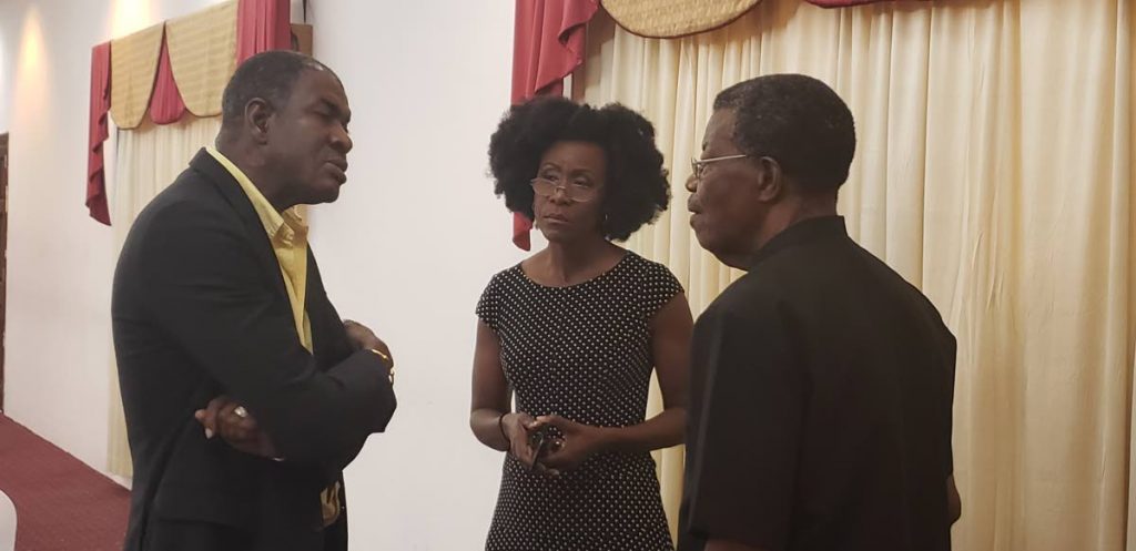Political leader of the Tobago Organisation of the People Ashworth Jack, left, chats with Tobago Forwards leader Christlyn Moore, centre,  and Platform of the Truth's leader Hochoy Charles at a recent press conference.