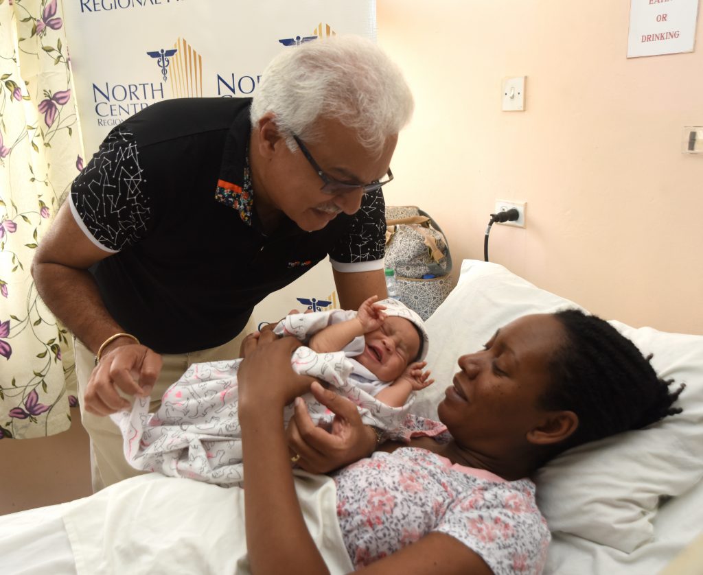 In this May 12 2019 file photo, Health Minister Terrence Deyalsingh cuddles Chevonn Park's newborn baby, Yara-Lee, at Mt Hope Women's Hospital.

Photo: Kerwin Pierre