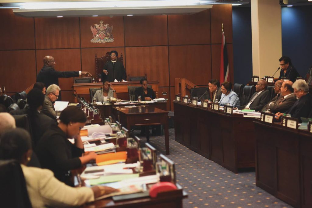 Prime Minister Dr Keith Rowley makes a point to the Opposition, led by Kamla Persad-Bissessar during a debate earlier this year. FILE PHOTO