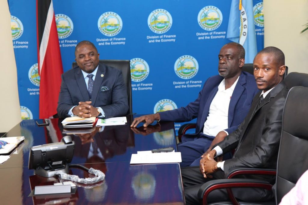 Secretary of the Division of Finance and the Economy Joel Jack, left, at a recent budget consultation meeting with Tobago Agricultural Society head Dedan Daniel and treasurer of the Bee-Keepers Association James Keron at the Victor E Bruce Complex, Scarborough. 
