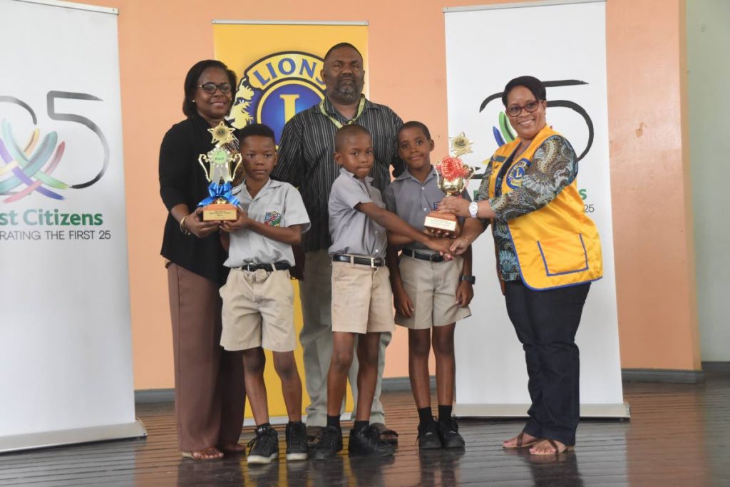 Arima Lions Mental Mathematics Olympiad III winners Elle Briggs, Tristan Lebon and Kaidell James of the Arima Boys’ RC School pose with their teacher Neil Khillawan and Arima Lions Club members Jennifer Armstrong-Khan and Jeanne Blair.    